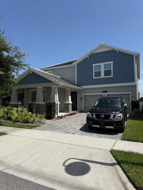 Blue two-story home after exterior repaint