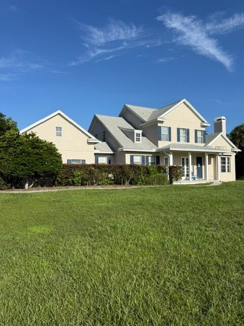 Cream two-story home after exterior painting