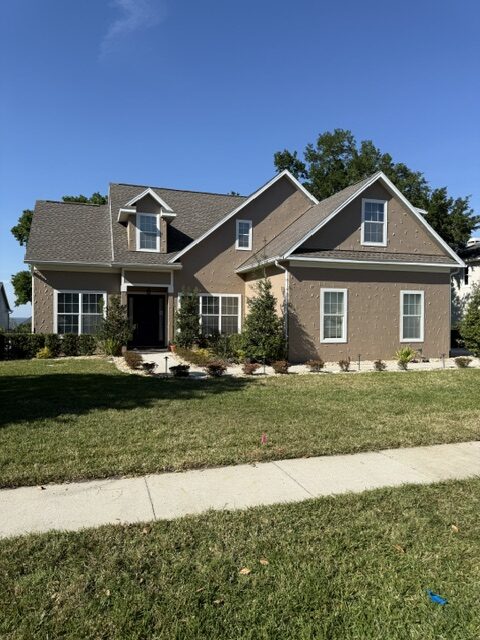Finished home exterior after repairs and painting