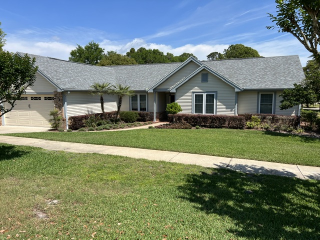 Clean siding and walkway on a ranch home