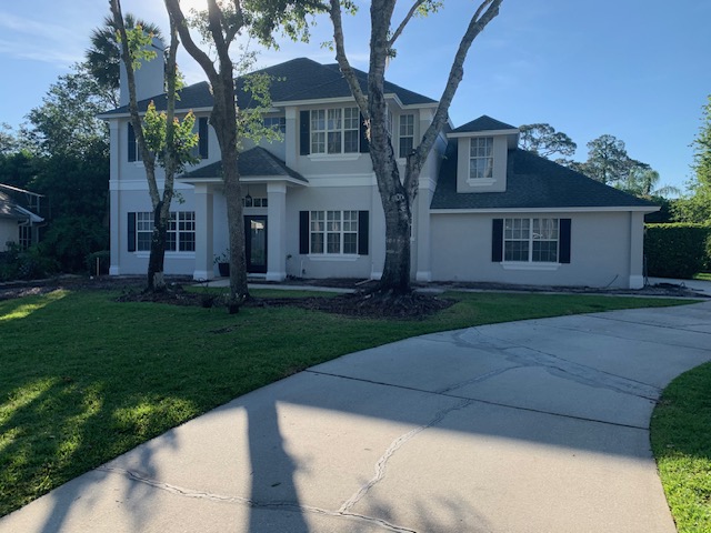 Ranch home with a sealed paver driveway
