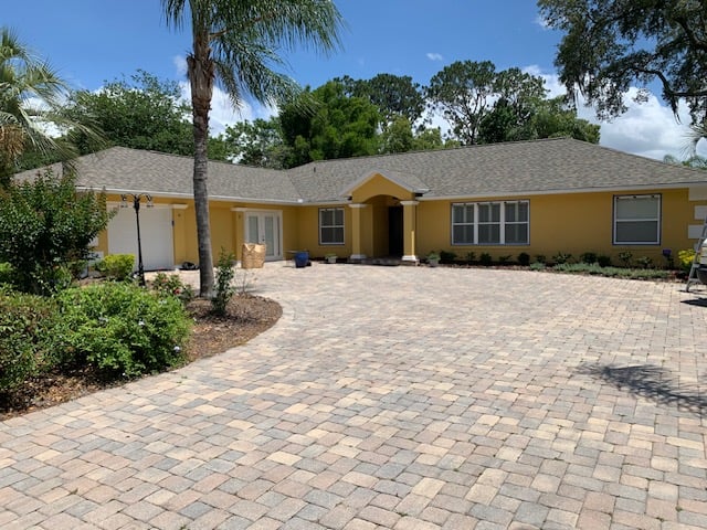 Clean driveway and exterior after pressure washing